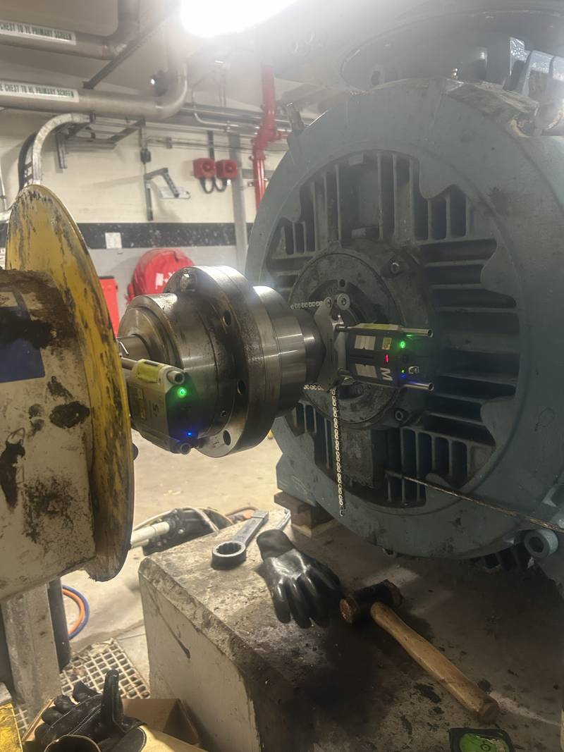 Laser alignment units fitted to a large electric motor coupling