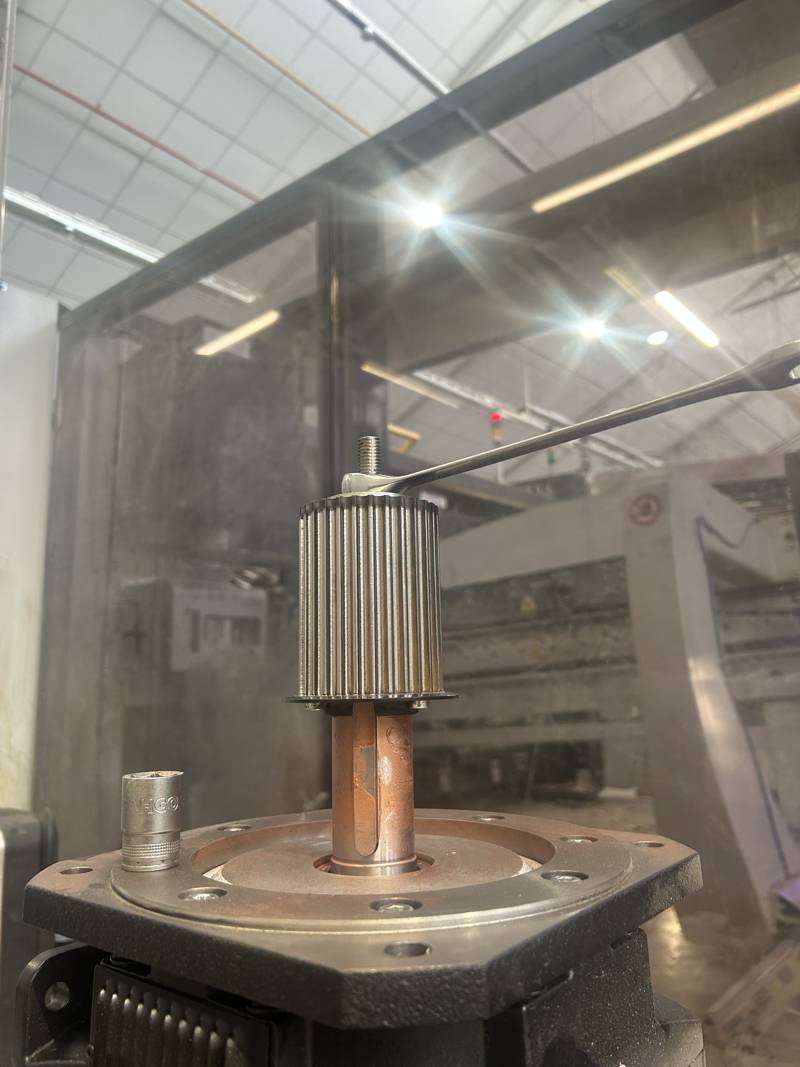 Timing pulley being fitted to a servo motor shaft